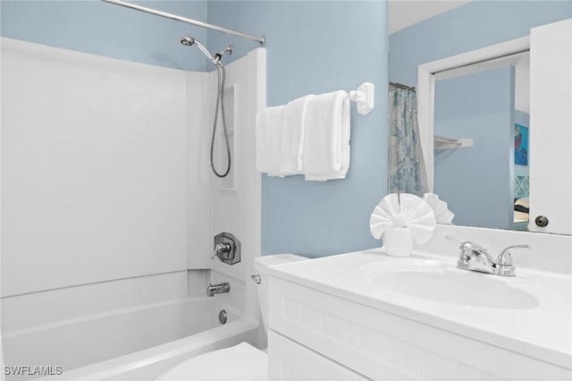 full bathroom featuring shower / bath combo with shower curtain, vanity, and toilet