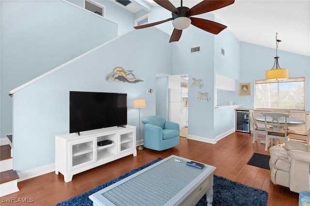 living room with high vaulted ceiling, ceiling fan, wine cooler, and dark hardwood / wood-style floors