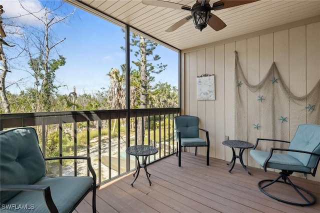 sunroom / solarium with ceiling fan