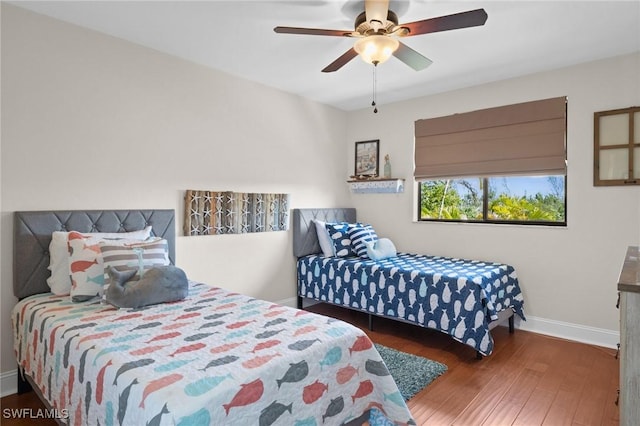 bedroom with ceiling fan and hardwood / wood-style floors