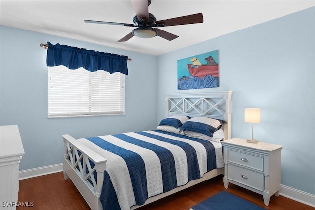 bedroom with ceiling fan and dark hardwood / wood-style floors