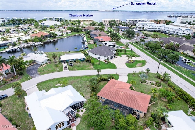 birds eye view of property featuring a water view