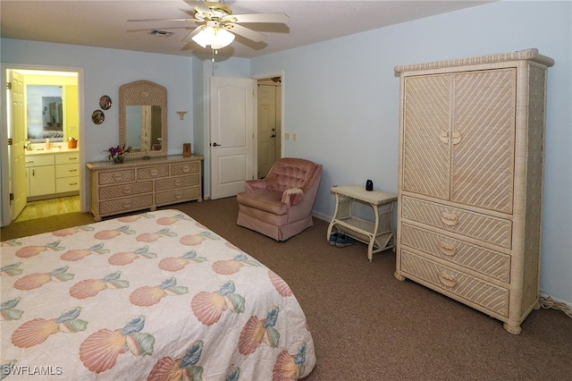 carpeted bedroom featuring ensuite bathroom, ceiling fan, and sink