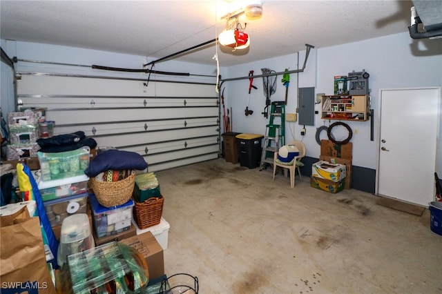 garage with electric panel and a garage door opener