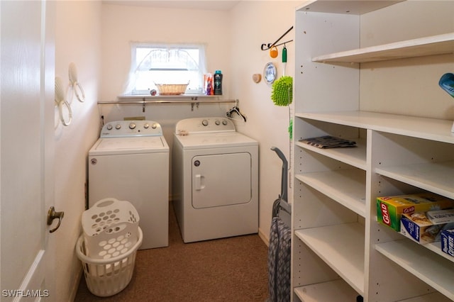 laundry room featuring washer and clothes dryer and carpet flooring