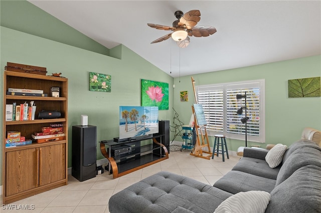 living room with ceiling fan, light tile patterned floors, and vaulted ceiling