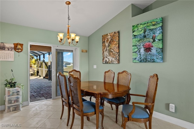 tiled dining room featuring vaulted ceiling and a chandelier