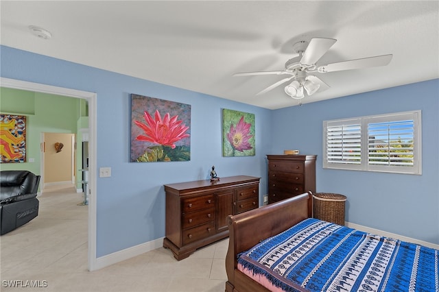 tiled bedroom with ceiling fan