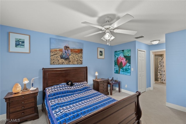 bedroom with ceiling fan and a closet