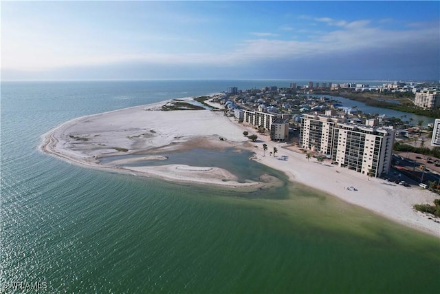 birds eye view of property with a beach view and a water view