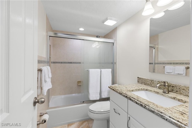 full bathroom with toilet, vanity, and combined bath / shower with glass door