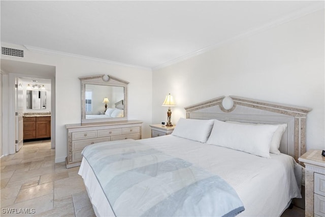 bedroom featuring ensuite bathroom and crown molding