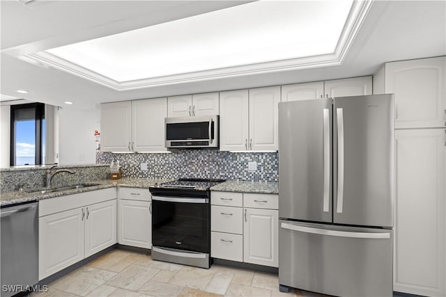 kitchen with sink, stainless steel appliances, and white cabinets