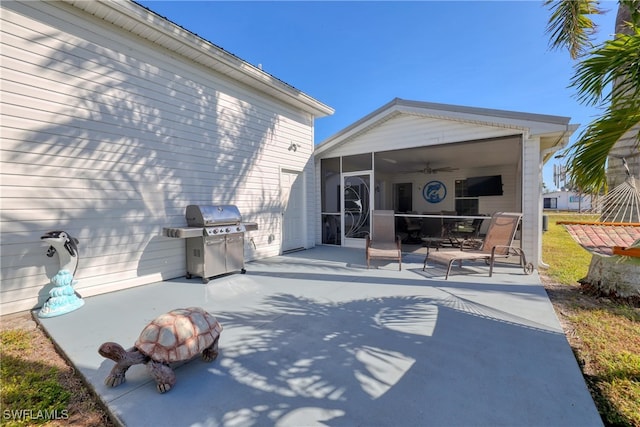 view of patio / terrace featuring a sunroom and area for grilling