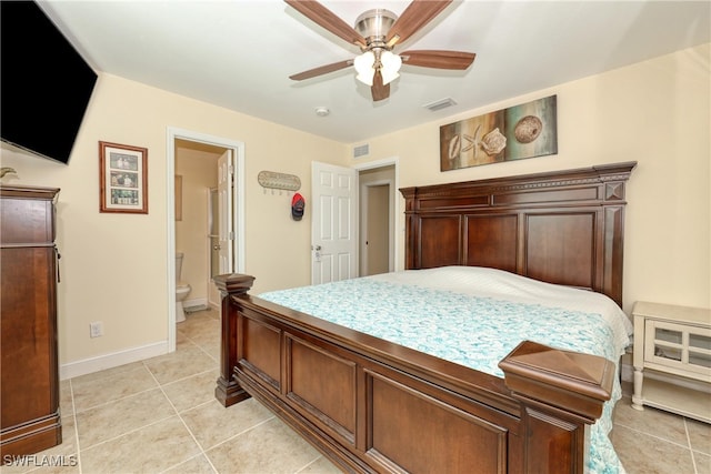 tiled bedroom featuring ensuite bath and ceiling fan