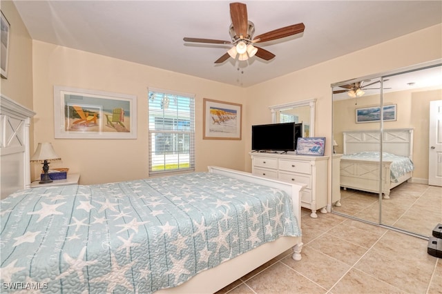 tiled bedroom featuring ceiling fan