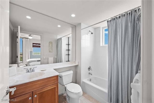 full bathroom featuring tile patterned floors, vanity, toilet, ceiling fan, and shower / bath combo