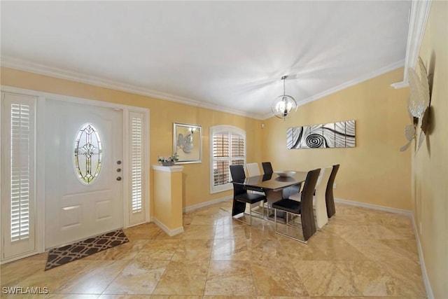 dining area featuring crown molding and an inviting chandelier