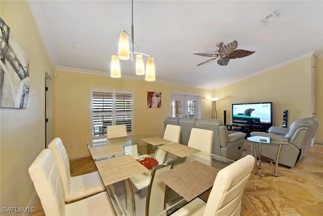 dining room featuring ceiling fan and ornamental molding