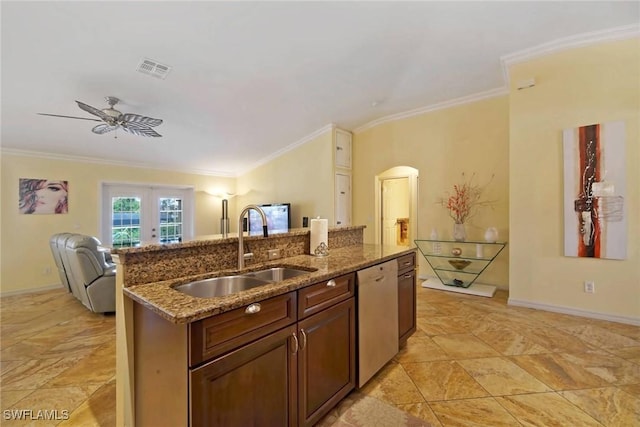 kitchen featuring french doors, a center island with sink, sink, stainless steel dishwasher, and ornamental molding