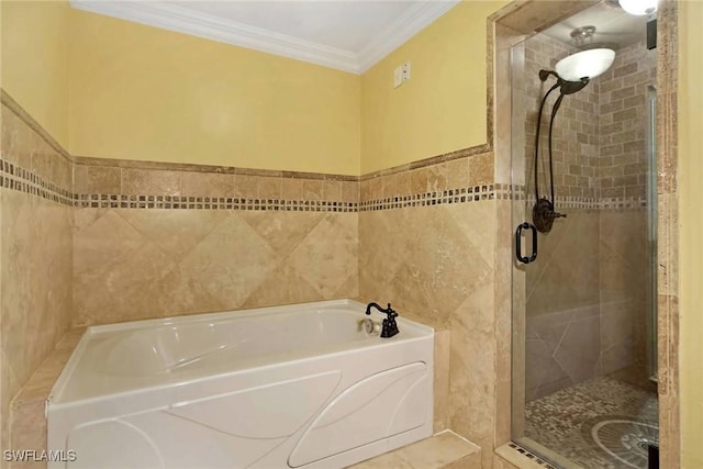 bathroom with separate shower and tub, tile walls, and ornamental molding