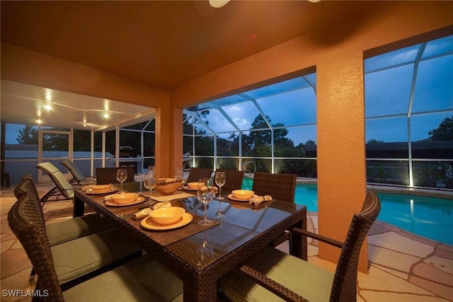 sunroom featuring a pool