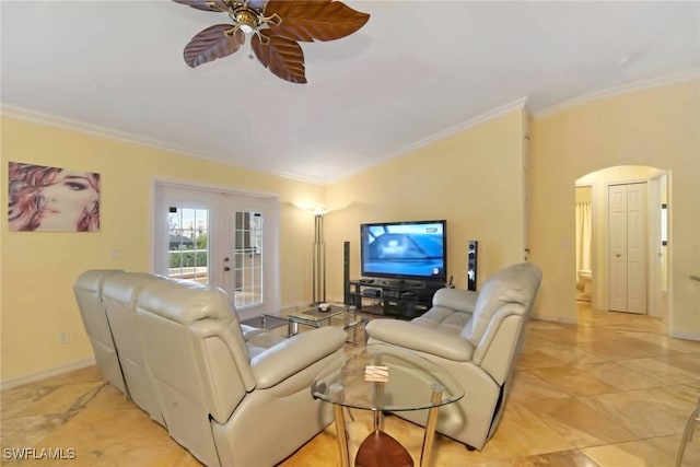 living room featuring ceiling fan and ornamental molding