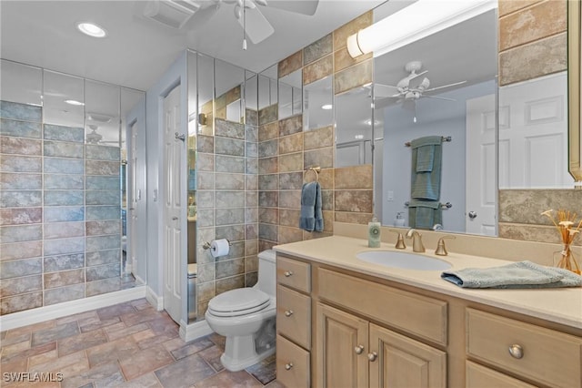 12701 Mastique Beach Blvd Unit 1601, Fort Myers, FL 33908 - full bathroom featuring vanity, ceiling fan, stone finish floor, and toilet