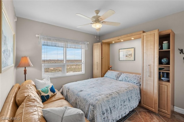 tiled bedroom with ceiling fan