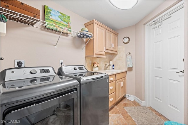 12701 Mastique Beach Blvd Unit 1601, Fort Myers, FL 33908 - laundry room with a sink, separate washer and dryer, baseboards, and cabinet space