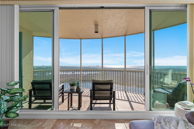 sunroom with a water view