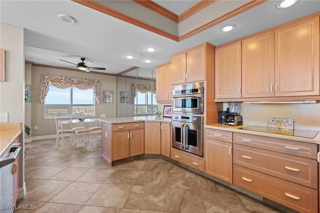 kitchen with kitchen peninsula, pendant lighting, ceiling fan, appliances with stainless steel finishes, and ornamental molding