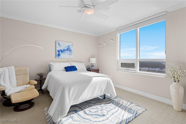 bedroom featuring ceiling fan, ornamental molding, and light carpet