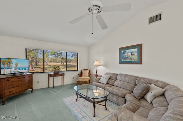 carpeted living room with ceiling fan and lofted ceiling