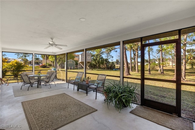 sunroom with plenty of natural light and ceiling fan