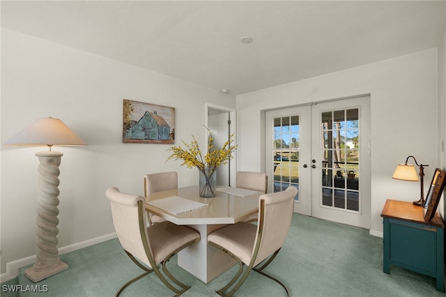 dining room with french doors and carpet flooring