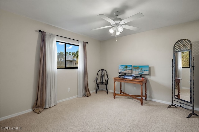 misc room featuring light carpet and ceiling fan