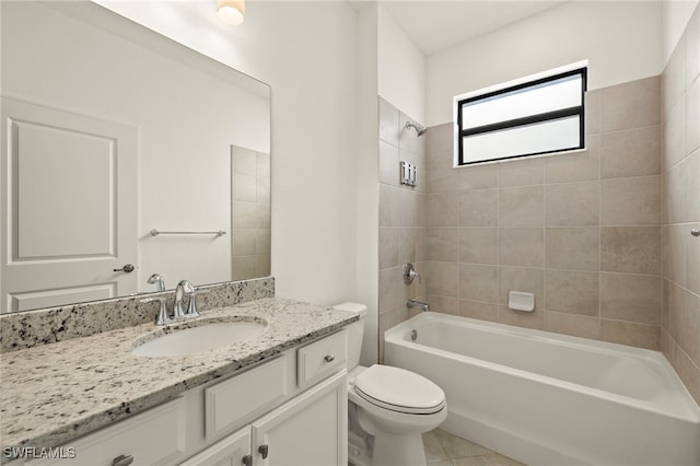 full bathroom with tile patterned floors, toilet, vanity, and tiled shower / bath