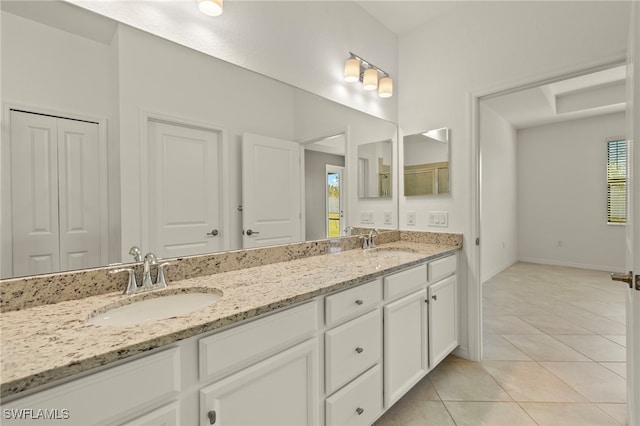 bathroom with tile patterned flooring and vanity