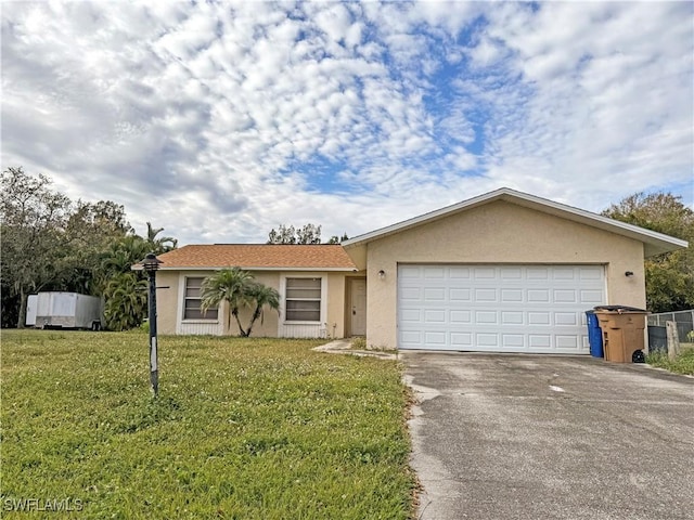 single story home with a front lawn and a garage