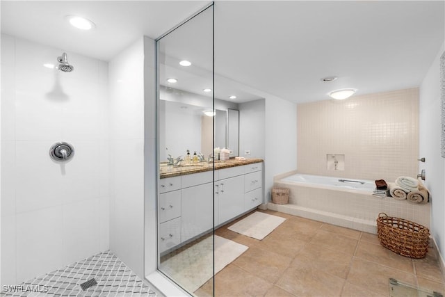 bathroom featuring tile patterned floors, vanity, and separate shower and tub