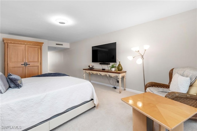 bedroom featuring light colored carpet