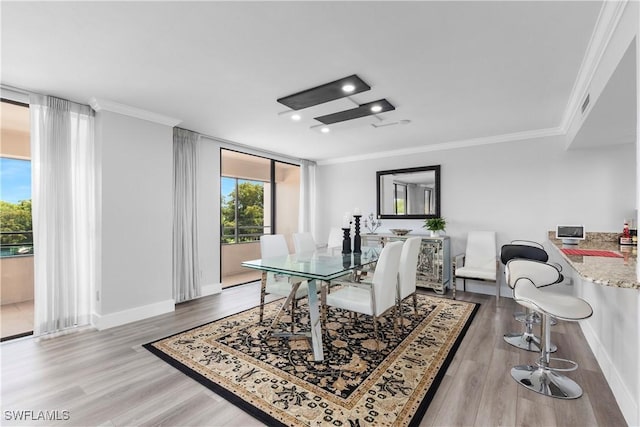 interior space with hardwood / wood-style floors and ornamental molding