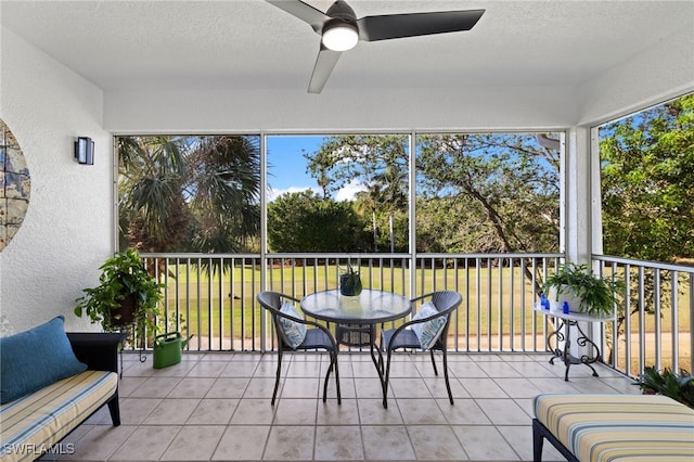 sunroom with a ceiling fan