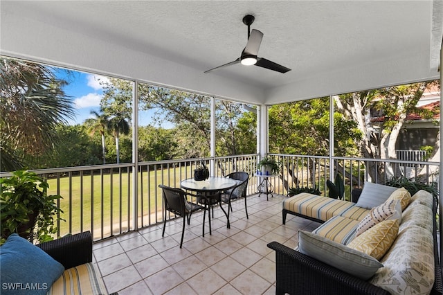 sunroom / solarium with ceiling fan