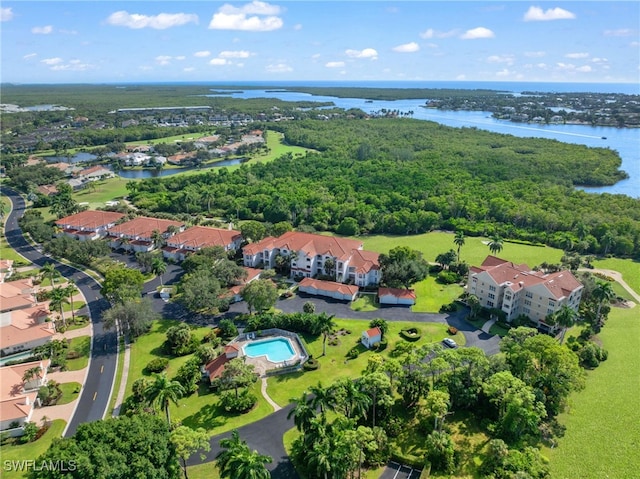 drone / aerial view featuring a water view and a residential view