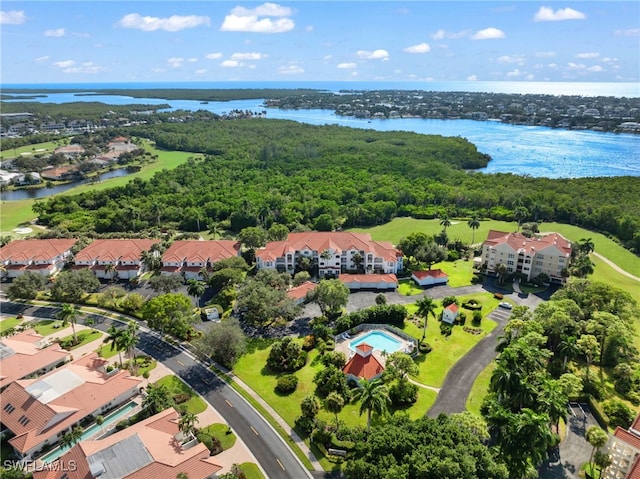 bird's eye view featuring a water view and a residential view