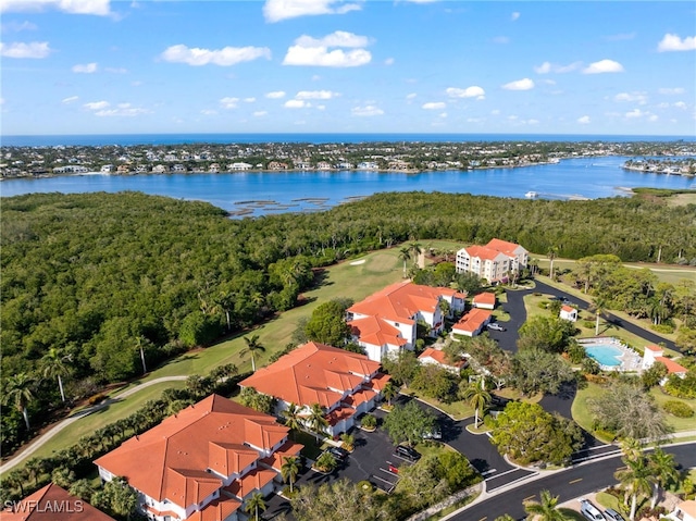 birds eye view of property with a water view and a residential view