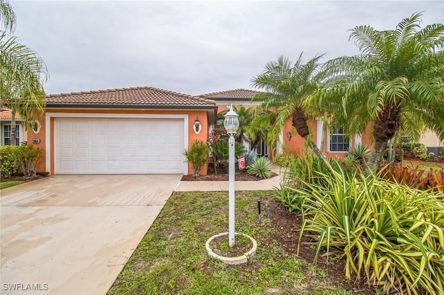 mediterranean / spanish-style home featuring a garage