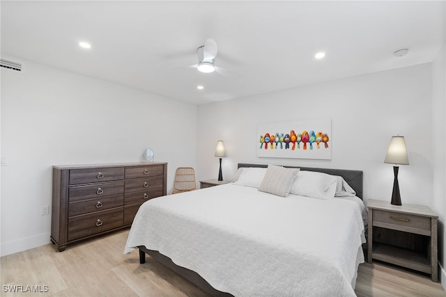 bedroom with ceiling fan and light hardwood / wood-style flooring